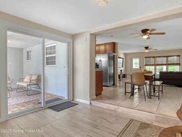 a view of a livingroom with furniture and windows