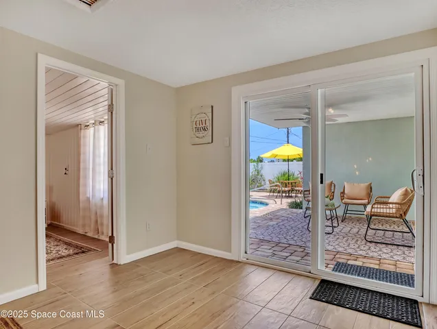 a view of a livingroom with furniture and front door