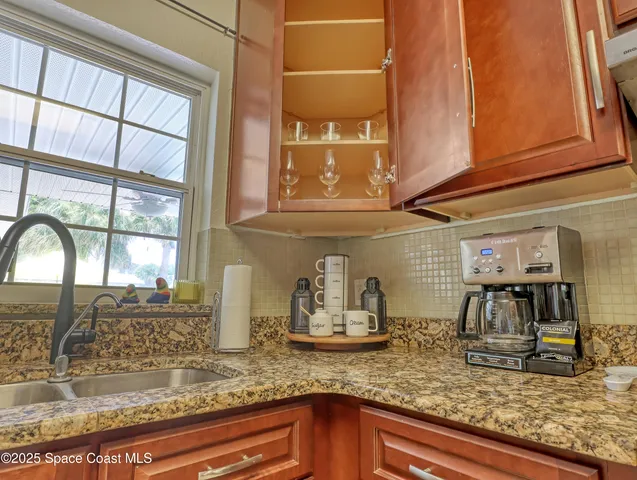 a kitchen with sink and window