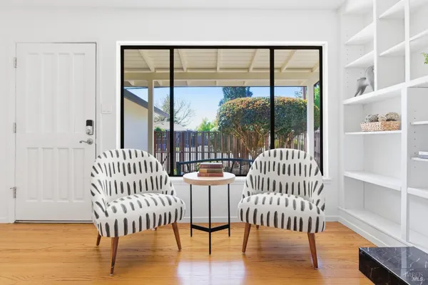a view of a balcony with furniture