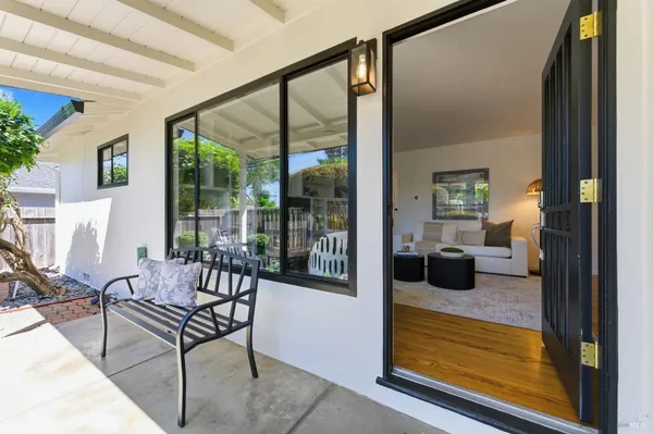 a view of a livingroom with furniture and front door