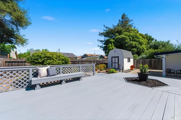 a house view with a sitting space and garden