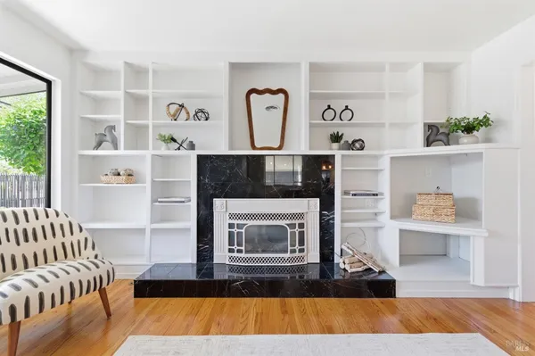 a living room with furniture and a fireplace
