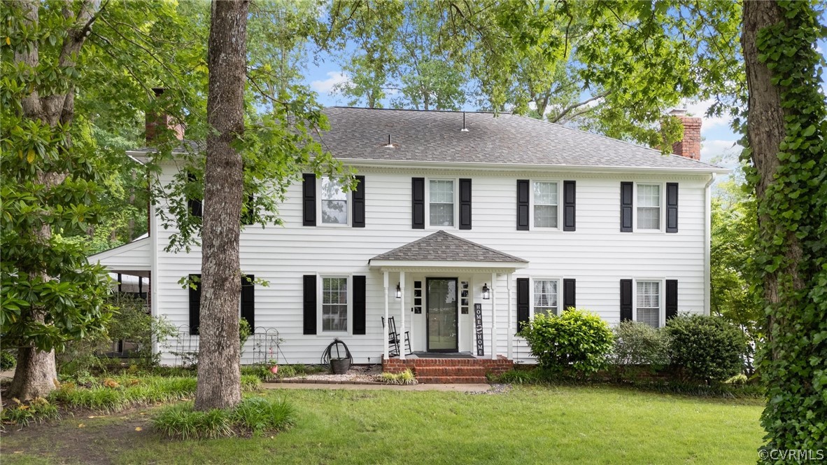 3905 Cresthill Road Chester, VA 23831 - Photo 1 of 49 a front view of a house with garden and porch