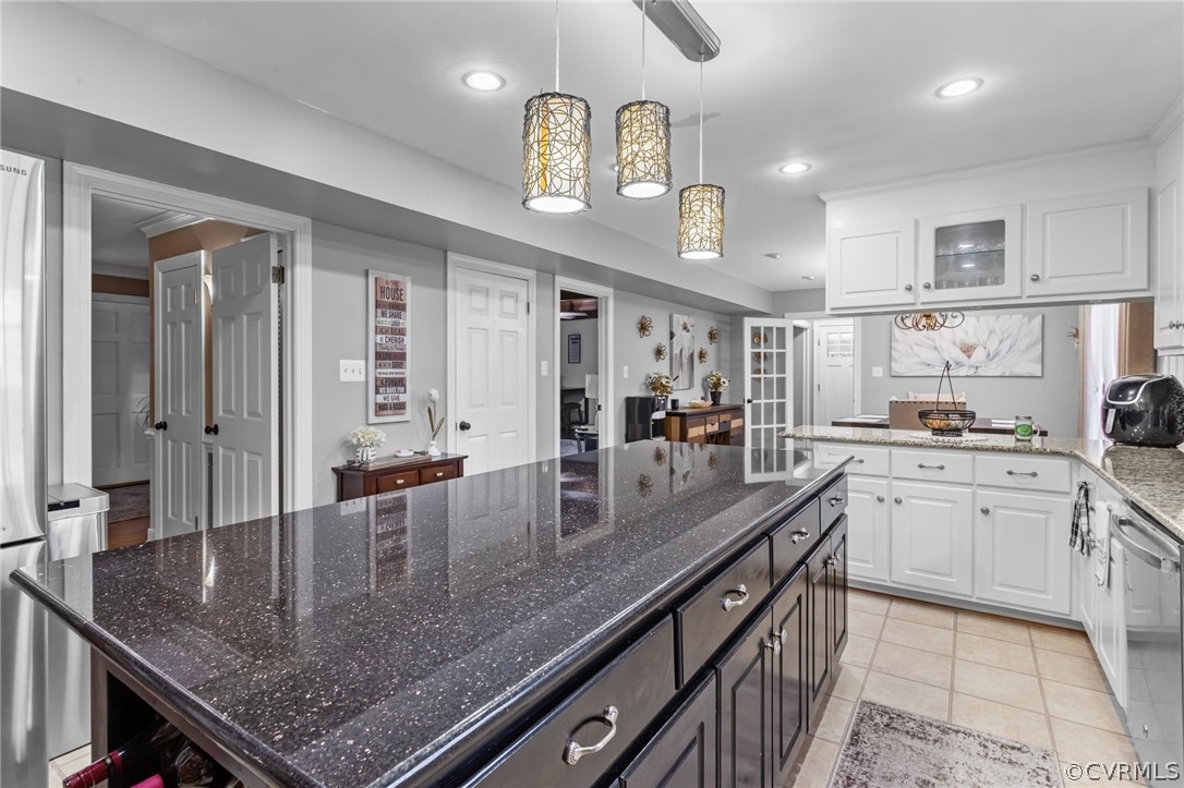 3905 Cresthill Road Chester, VA 23831 - Photo 15 of 49 a kitchen with center island table chairs sink and cabinets