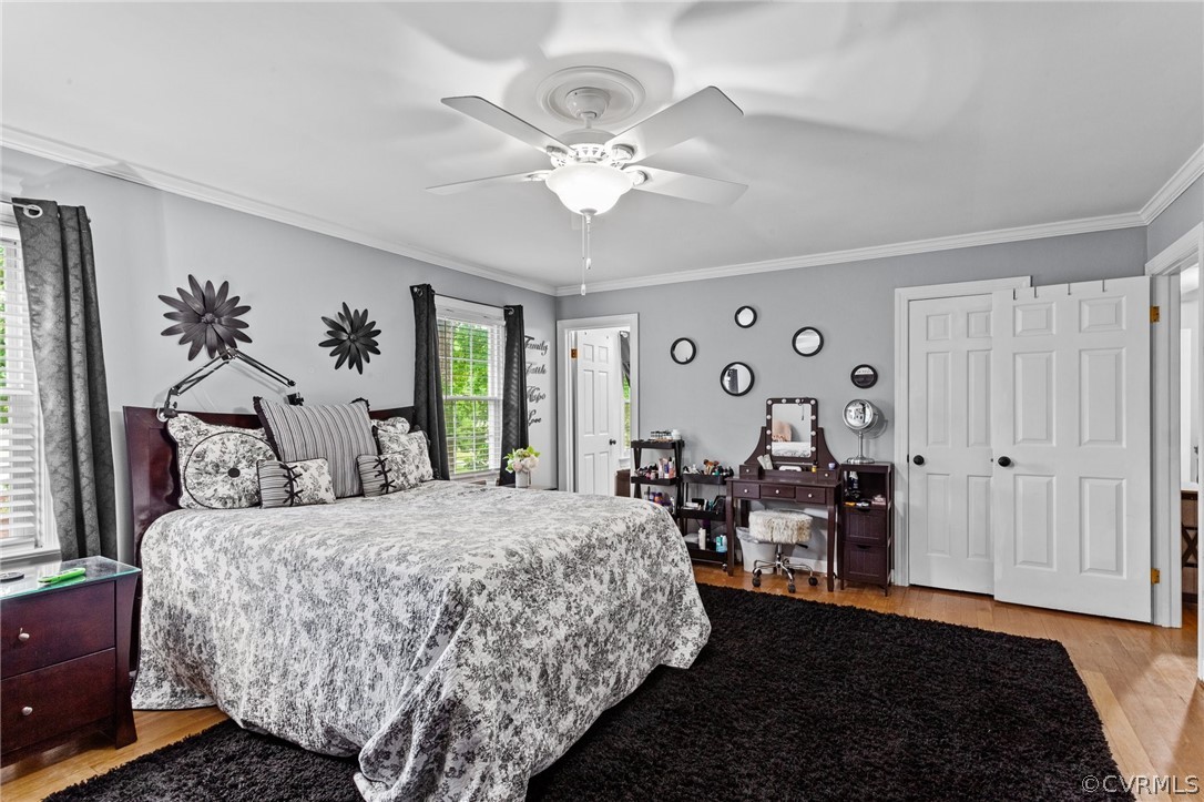 3905 Cresthill Road Chester, VA 23831 - Photo 23 of 49 a bedroom with a bed and a chandelier
