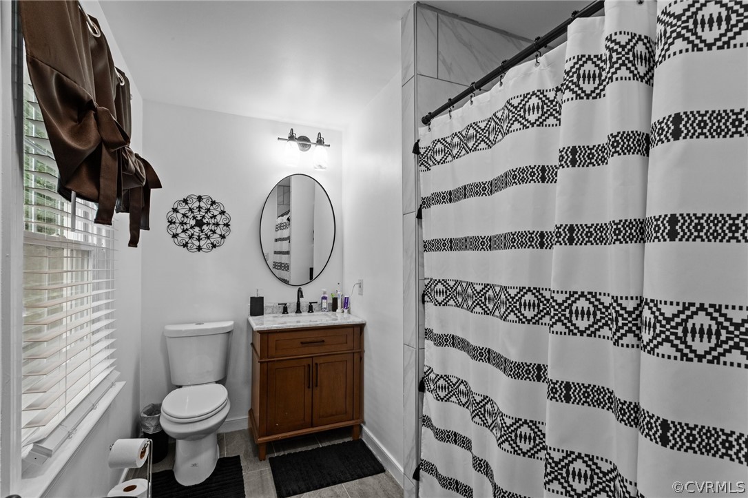 3905 Cresthill Road Chester, VA 23831 - Photo 25 of 49 a bathroom with a toilet and a sink