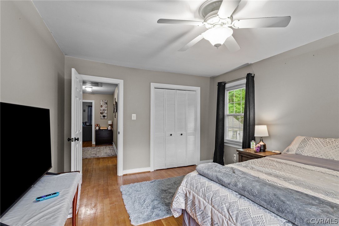3905 Cresthill Road Chester, VA 23831 - Photo 28 of 49 a bedroom with a bed and a chandelier