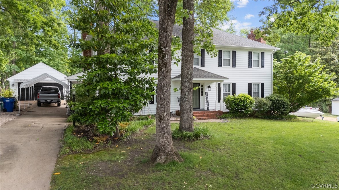 3905 Cresthill Road Chester, VA 23831 - Photo 3 of 49 a front view of a house with garden