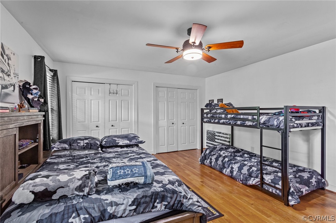 3905 Cresthill Road Chester, VA 23831 - Photo 32 of 49 a bedroom with a bed and a chandelier