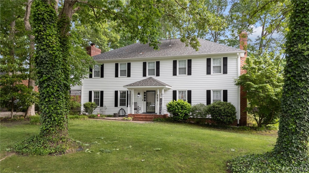3905 Cresthill Road Chester, VA 23831 - Photo 4 of 49 a front view of a house with garden