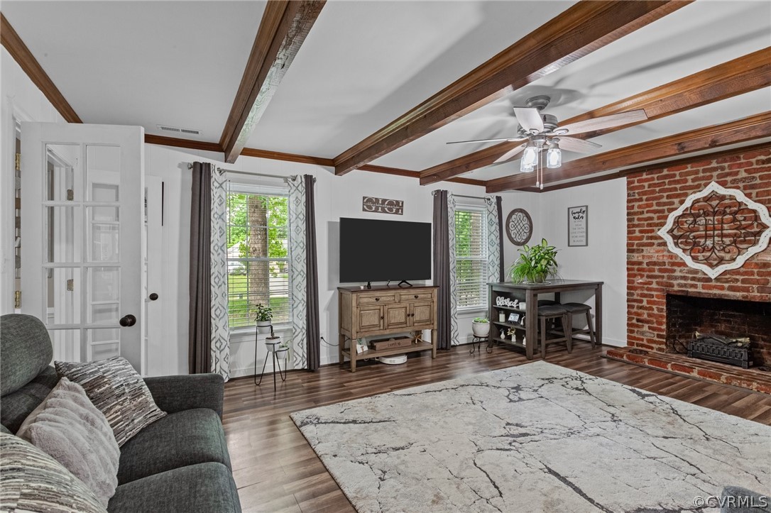 3905 Cresthill Road Chester, VA 23831 - Photo 6 of 49 a living room with furniture a flat screen tv and a fireplace