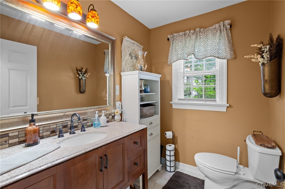 3905 Cresthill Road Chester, VA 23831 - Photo 10 of 49 a bathroom with a double vanity sink toilet and a mirror