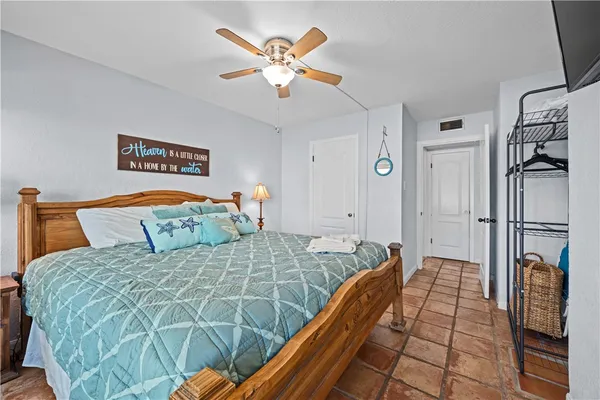 a bedroom with a bed and a walk in closet