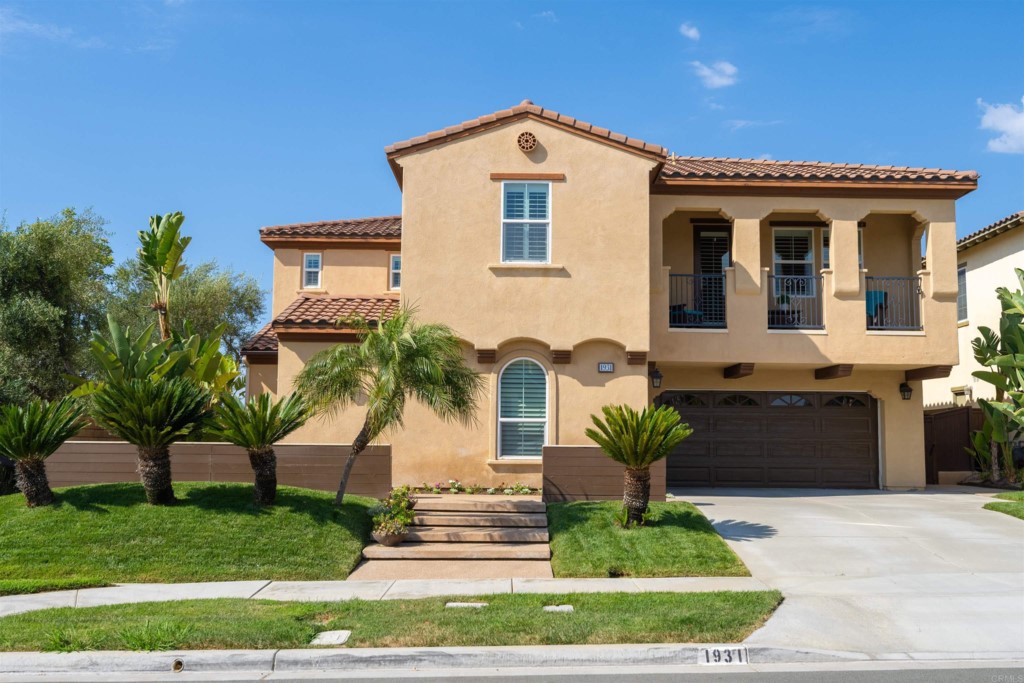 1931 Corte Cantante Chula Vista, CA 91914 - Photo 1 of 61 a front view of a house with a garden
