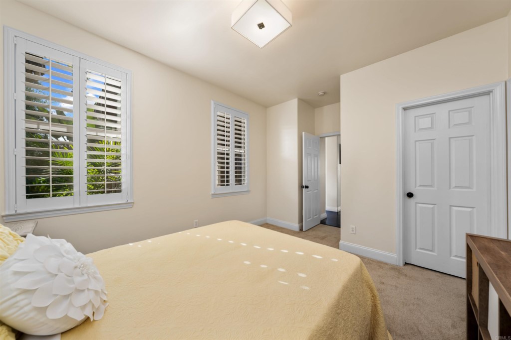1931 Corte Cantante Chula Vista, CA 91914 - Photo 25 of 61 a bedroom with a bed and a window