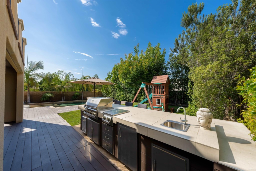 1931 Corte Cantante Chula Vista, CA 91914 - Photo 48 of 61 a view of a house with pool outdoor seating area and furniture
