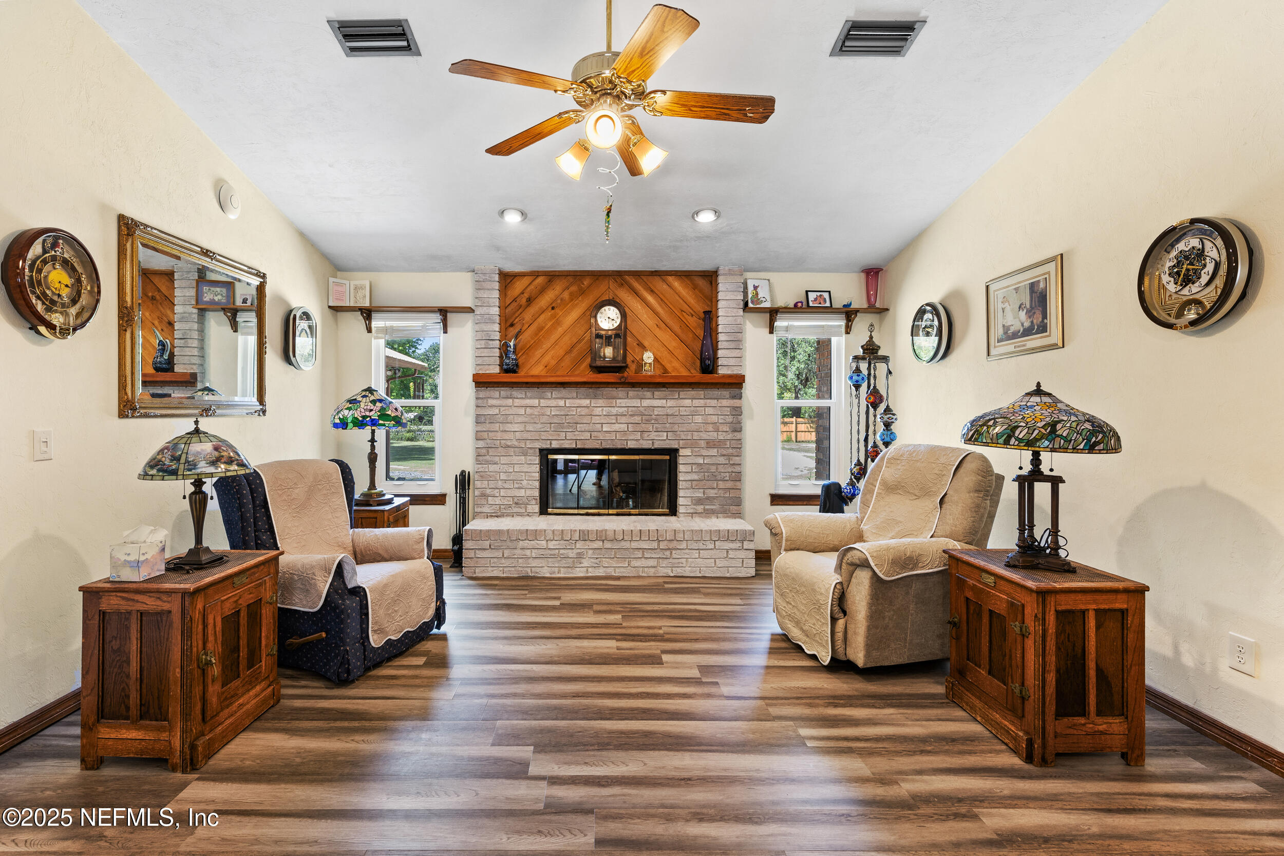 6335 Payne Road Keystone Heights, FL 32656 - Photo 8 of 51 a living room with furniture a flat screen tv and a fireplace