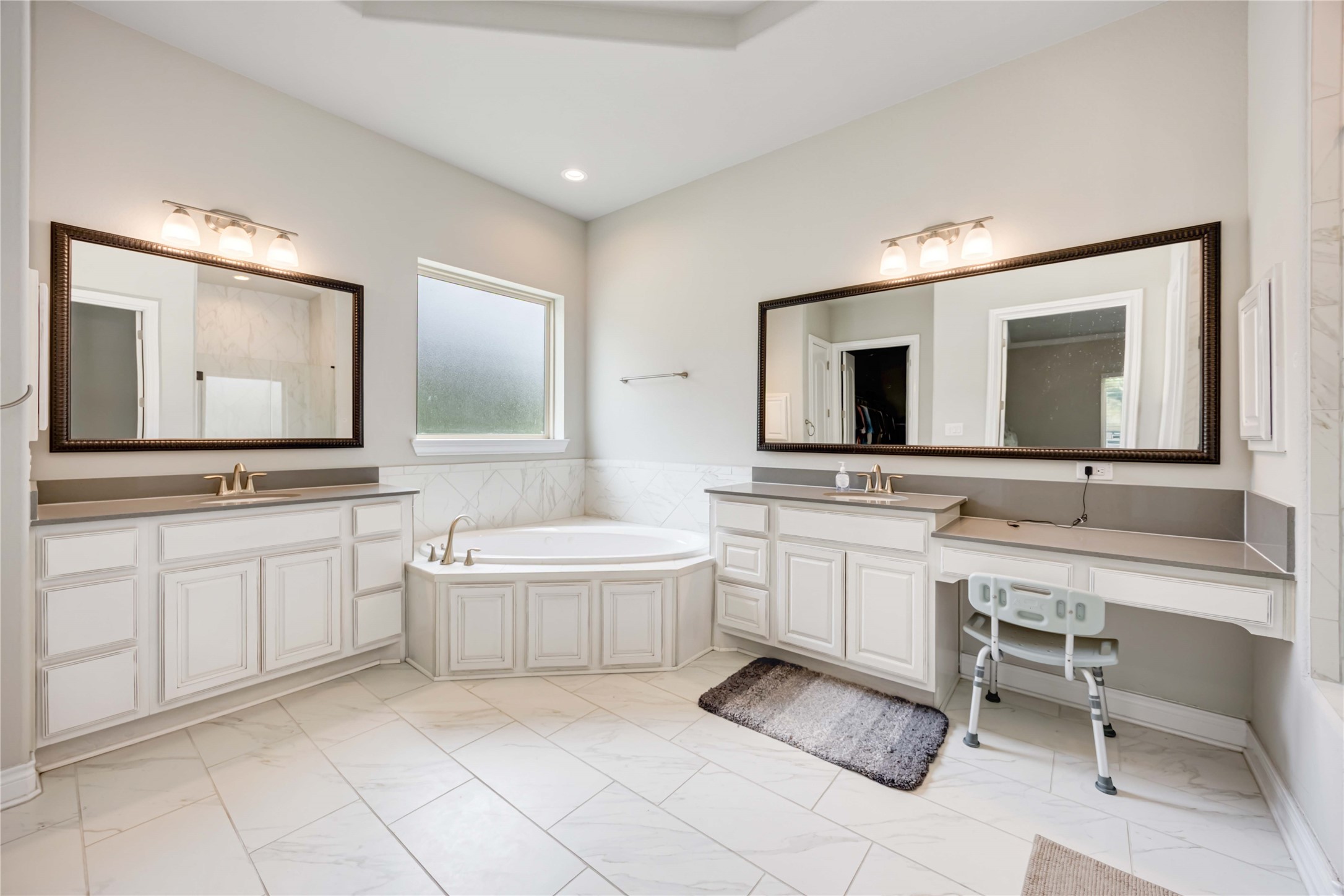 5202 Creekmore Circle Spring, TX 77389 - Photo 11 of 24 a bathroom with a double vanity sink and mirror