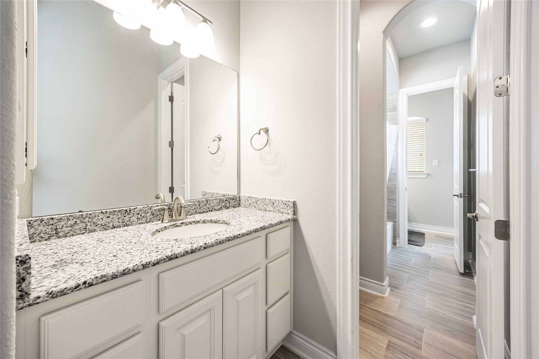 5202 Creekmore Circle Spring, TX 77389 - Photo 15 of 24 a bathroom with a granite countertop sink and a mirror