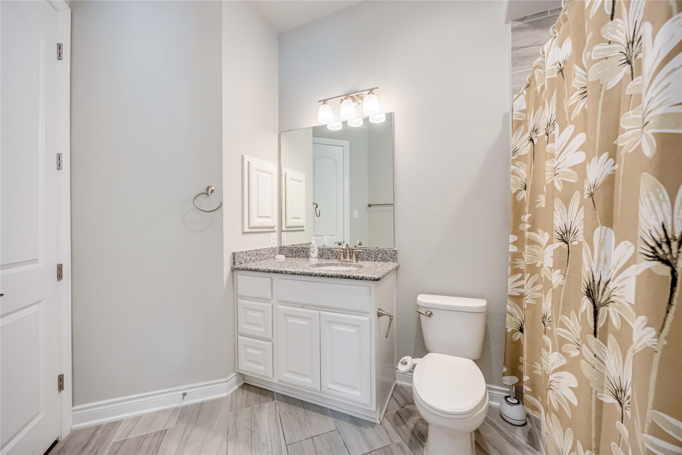 5202 Creekmore Circle Spring, TX 77389 - Photo 16 of 24 a bathroom with a sink a toilet and a mirror