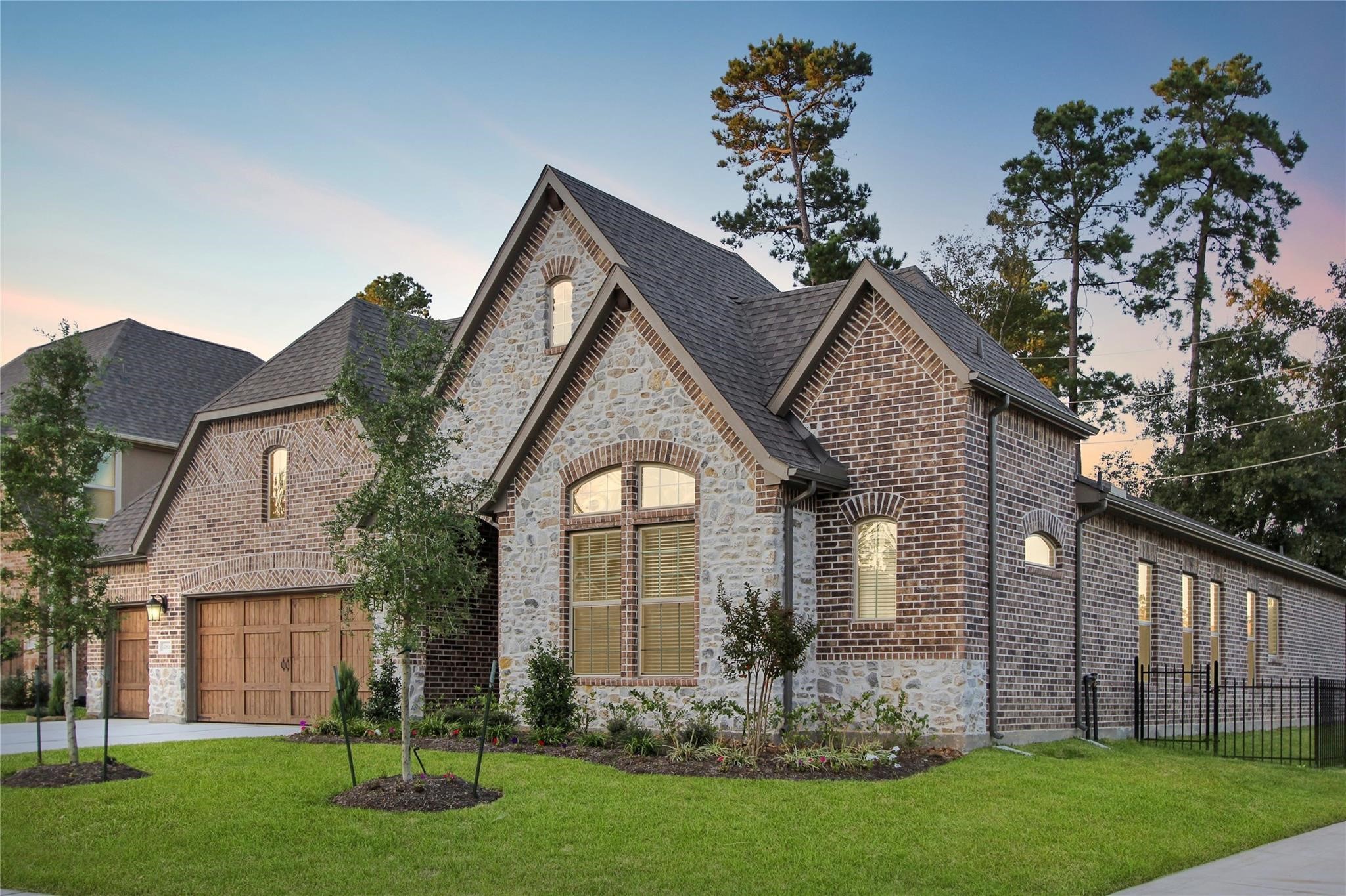 5202 Creekmore Circle Spring, TX 77389 - Photo 2 of 24 a front view of a house with a garden and plants