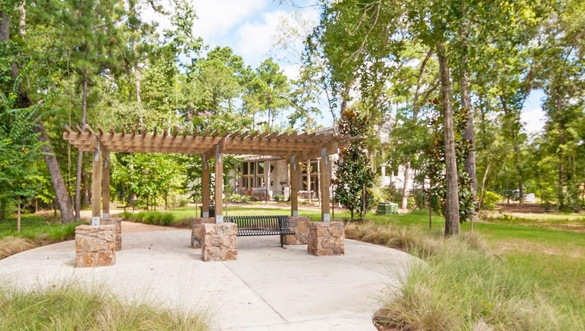 5202 Creekmore Circle Spring, TX 77389 - Photo 23 of 24 a view of a fountain with a bench in front of house