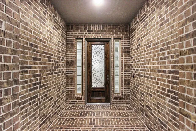 a view of a brick house with a door