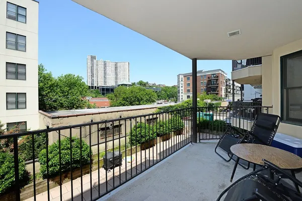 a view of a balcony with furniture