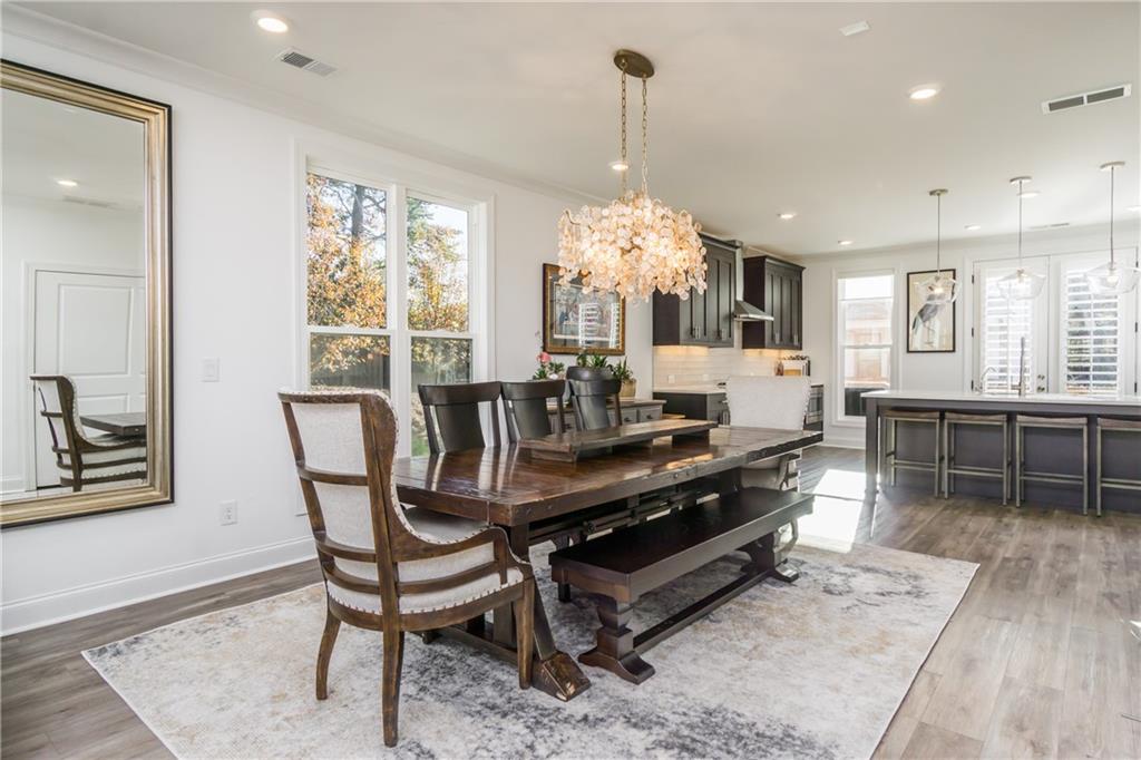 3106 Moor View Road Duluth, GA 30096 - Photo 13 of 39 a view of a dining room with furniture window and wooden floor