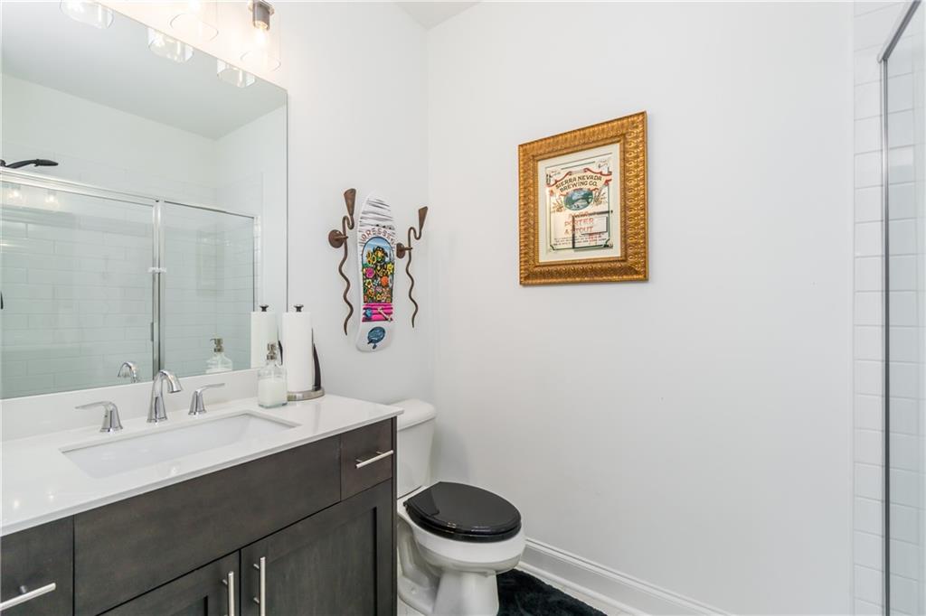 3106 Moor View Road Duluth, GA 30096 - Photo 24 of 39 a bathroom with a sink mirror and toilet