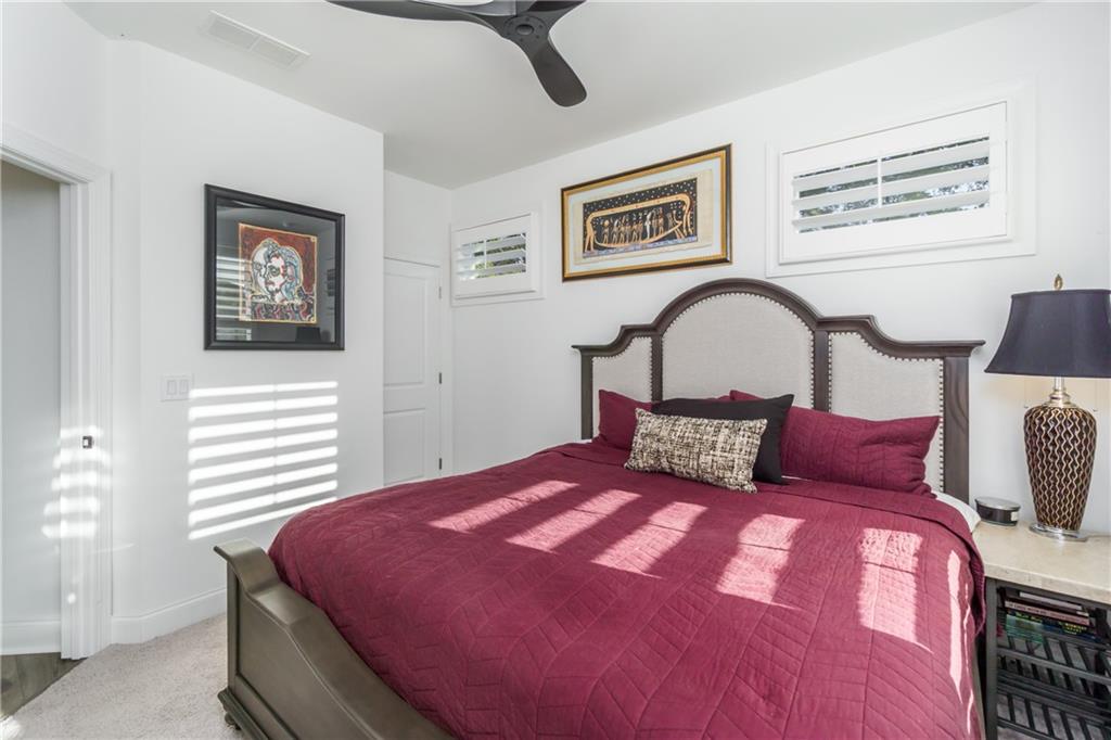 3106 Moor View Road Duluth, GA 30096 - Photo 27 of 39 a bedroom with a bed and a potted plant