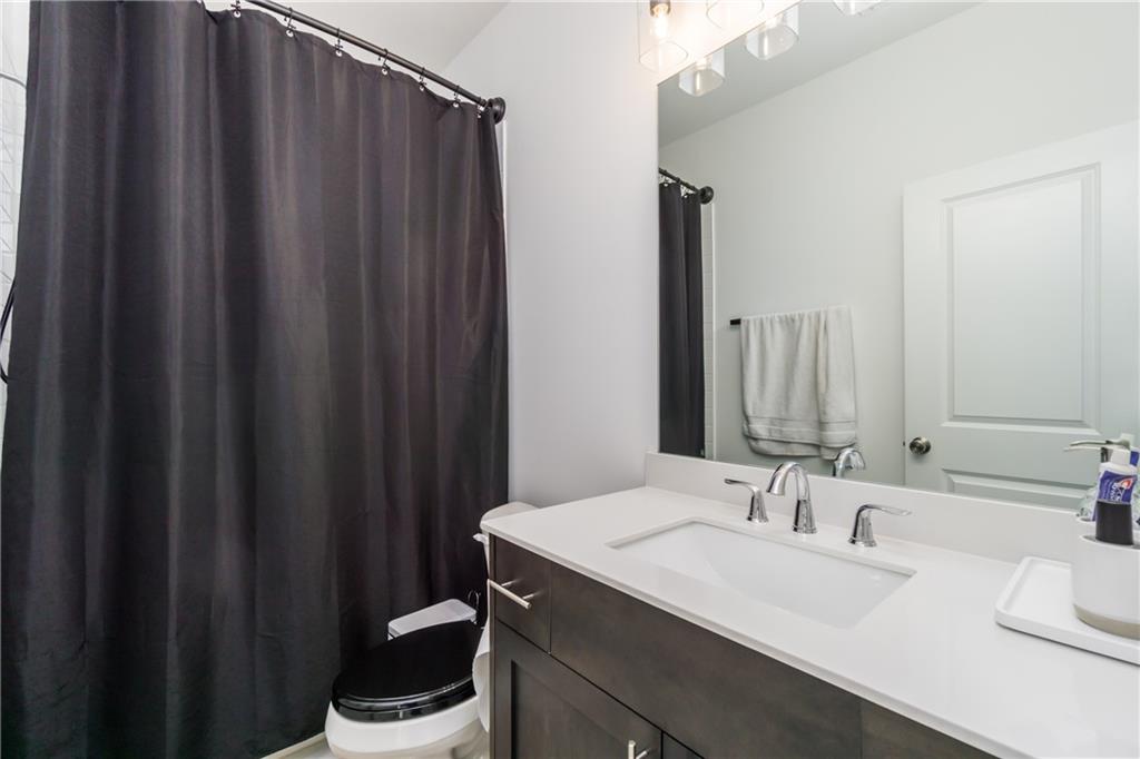 3106 Moor View Road Duluth, GA 30096 - Photo 28 of 39 a bathroom with a sink and a mirror