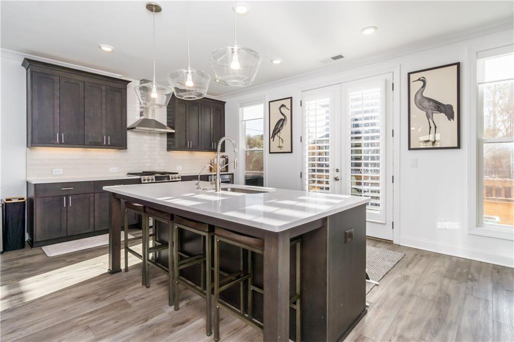3106 Moor View Road Duluth, GA 30096 - Photo 8 of 39 a kitchen with granite countertop a sink and a stove top oven