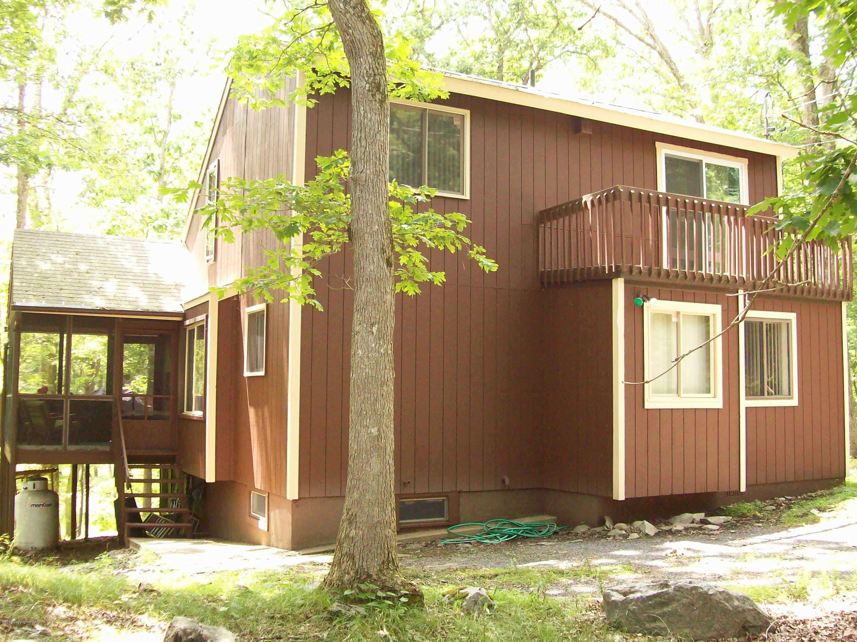 243 Canterbury Road Bushkill, PA 18324 - Photo 1 of 29 a front view of a house with a yard
