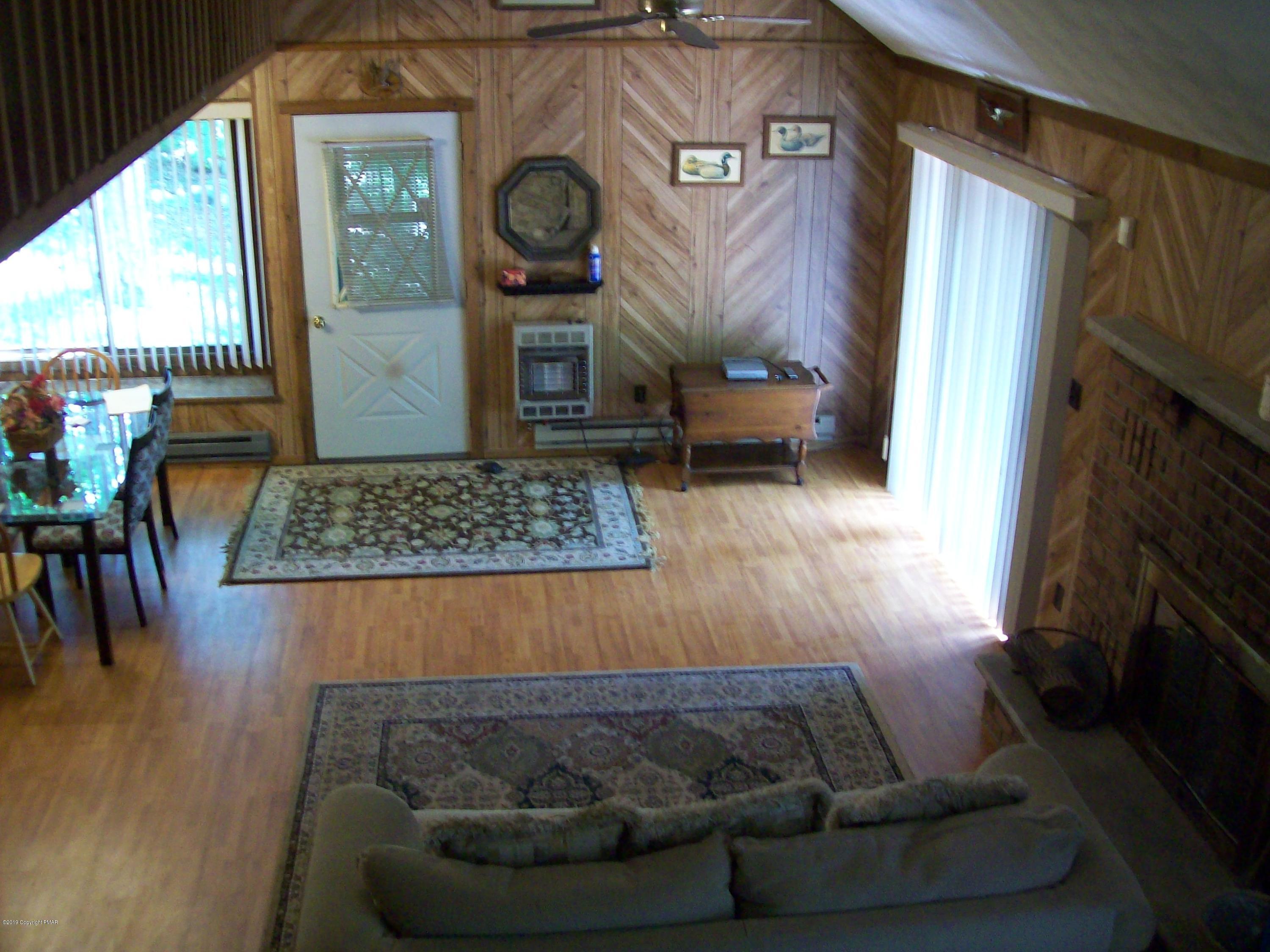 243 Canterbury Road Bushkill, PA 18324 - Photo 13 of 29 a living room with furniture and a flat screen tv