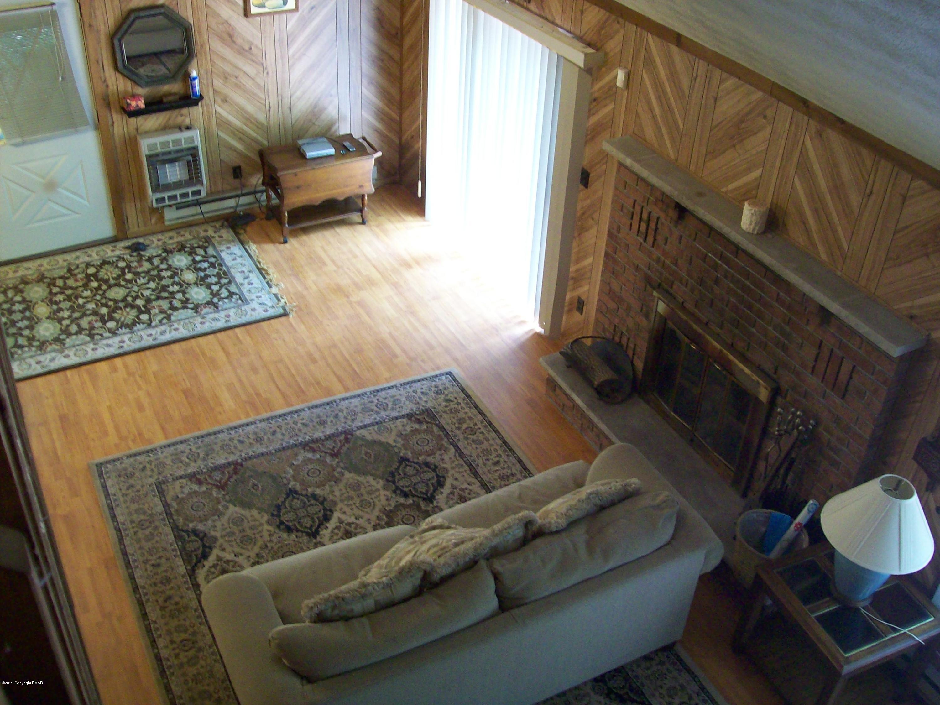 243 Canterbury Road Bushkill, PA 18324 - Photo 14 of 29 a view of living room with furniture and a rug