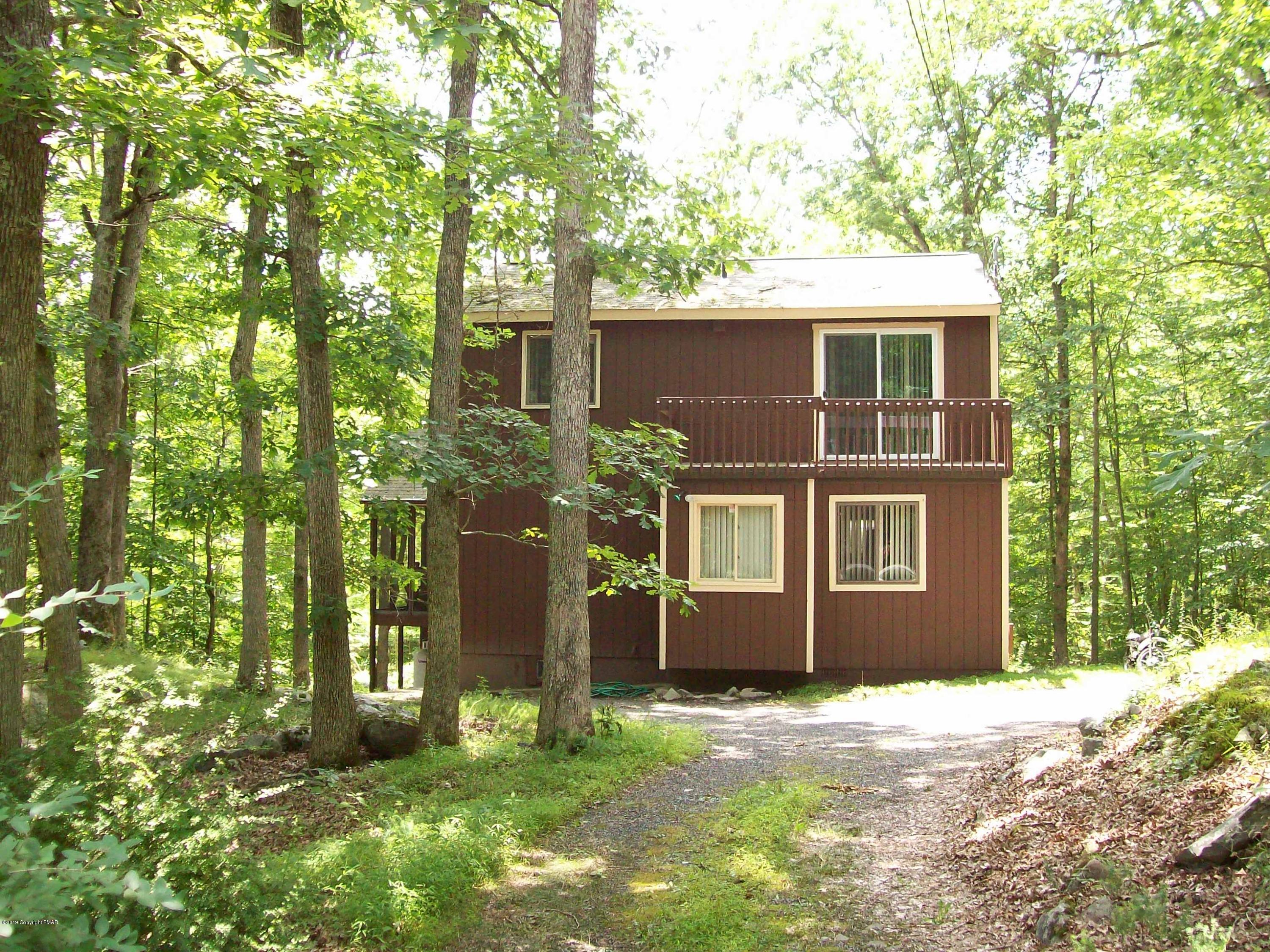 243 Canterbury Road Bushkill, PA 18324 - Photo 3 of 29 front view of a house with a yard