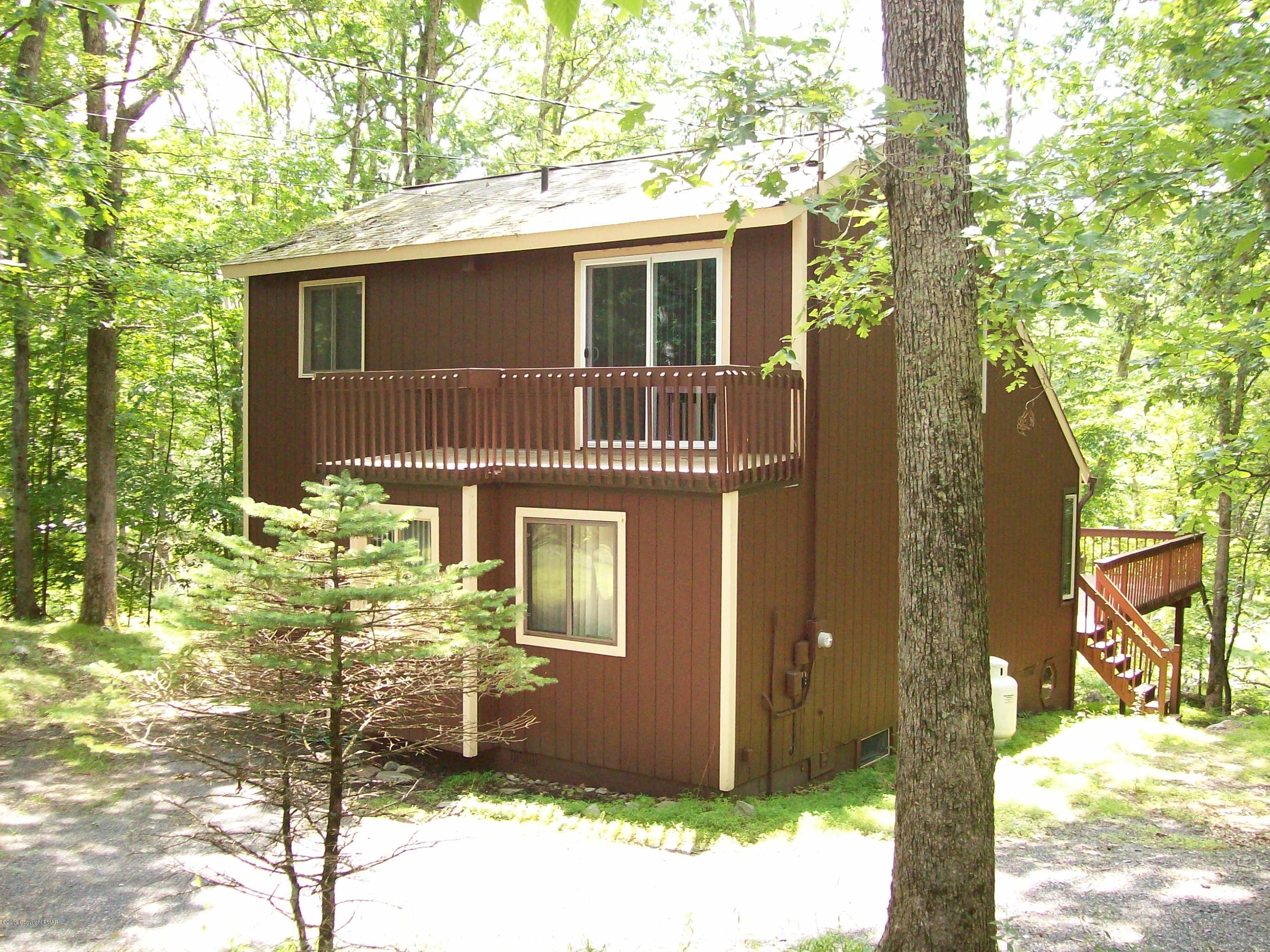 243 Canterbury Road Bushkill, PA 18324 - Photo 4 of 29 a front view of a house with a garden