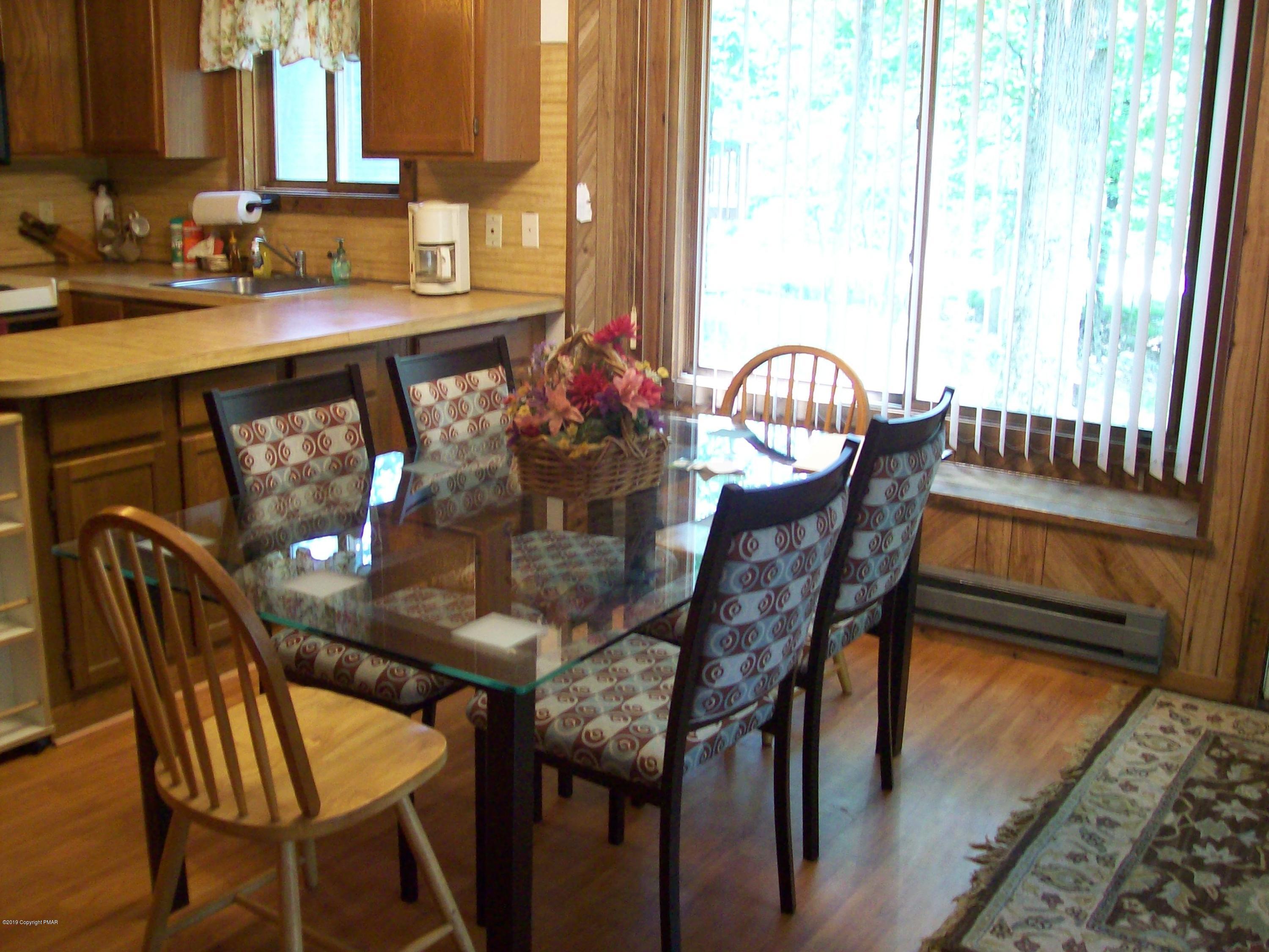 243 Canterbury Road Bushkill, PA 18324 - Photo 5 of 29 a view of a dining room with furniture and window