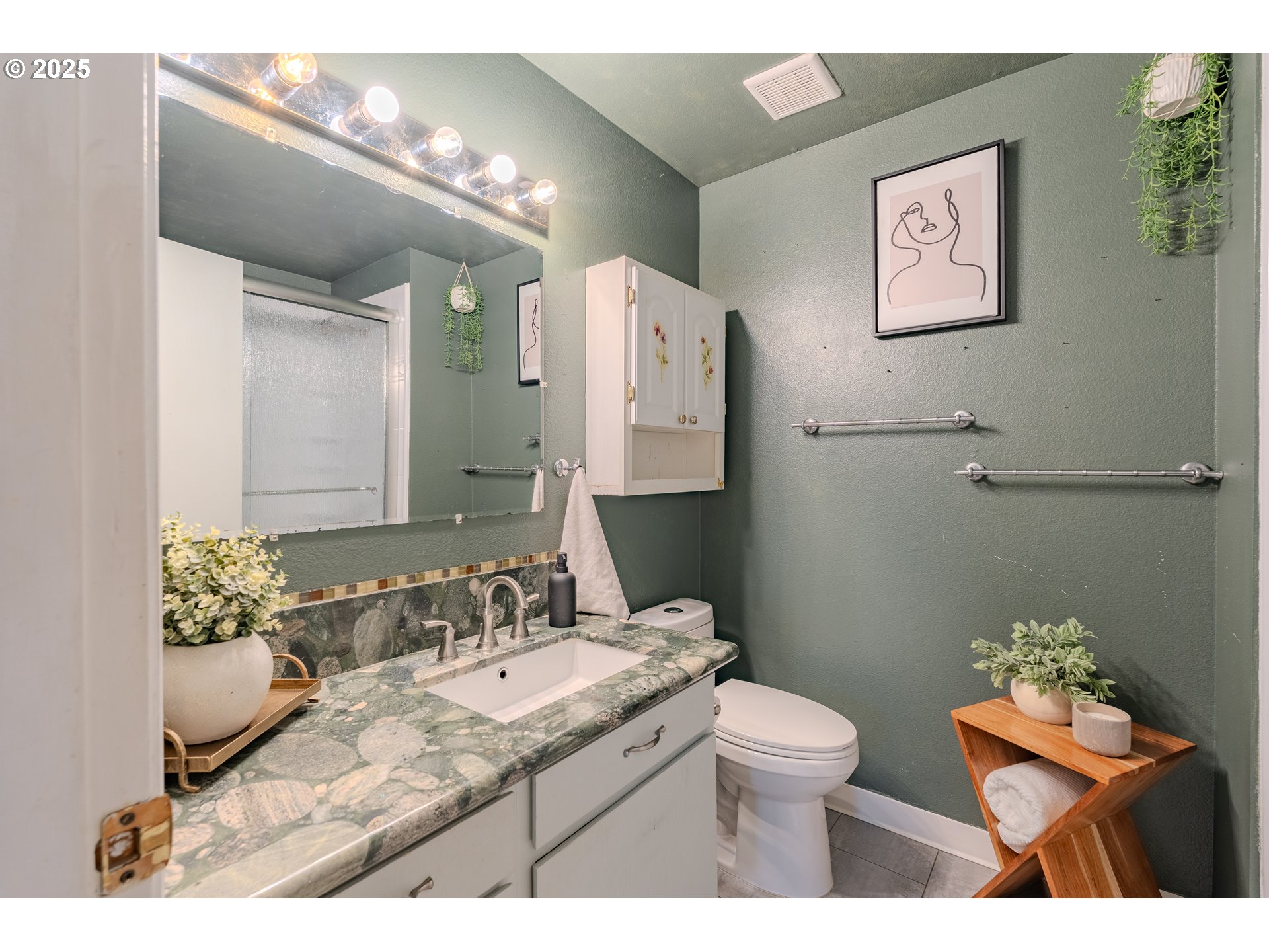 3270 Northwest Ivy Lane Camas, WA 98607 - Photo 12 of 26 a bathroom with a granite countertop sink a toilet and a mirror