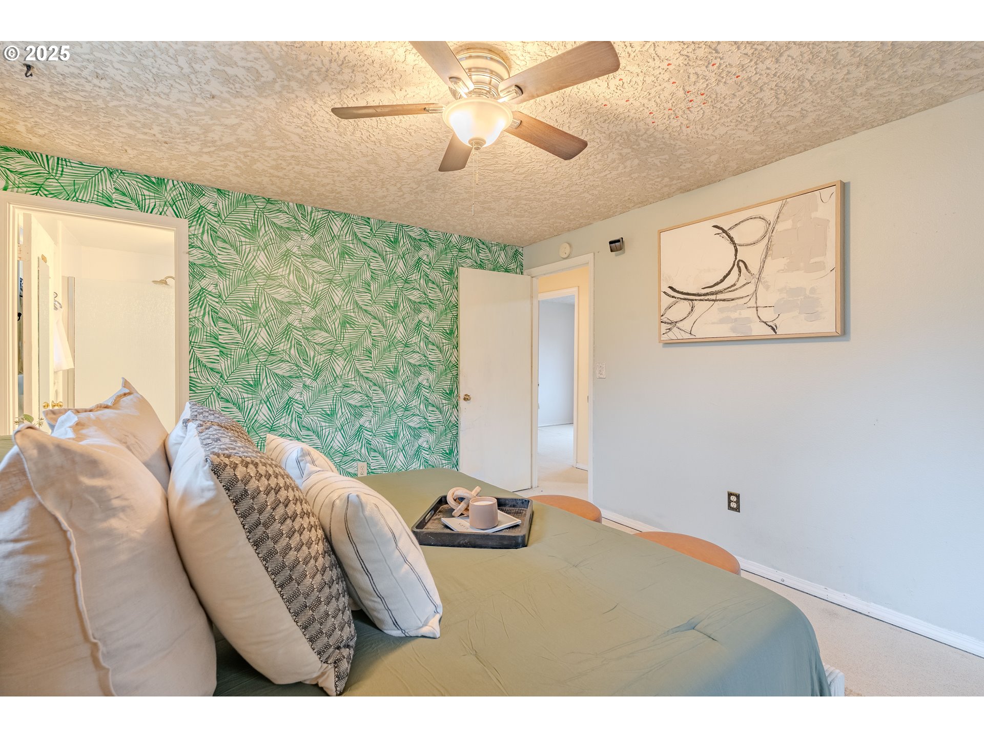 3270 Northwest Ivy Lane Camas, WA 98607 - Photo 15 of 26 a bedroom with a bed and a chandelier