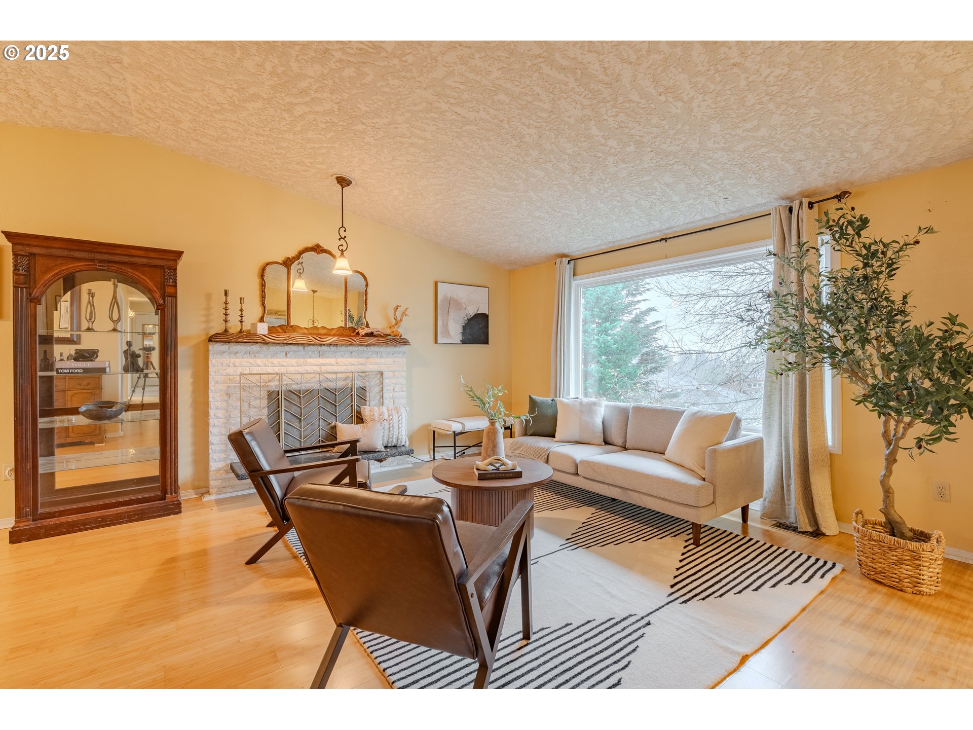 3270 Northwest Ivy Lane Camas, WA 98607 - Photo 2 of 26 a living room with fireplace furniture and a large window