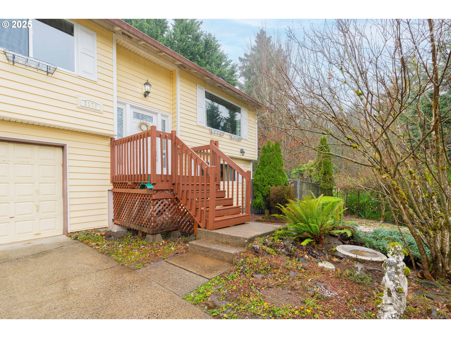 3270 Northwest Ivy Lane Camas, WA 98607 - Photo 26 of 26 a backyard of a house with a garden and outdoor seating