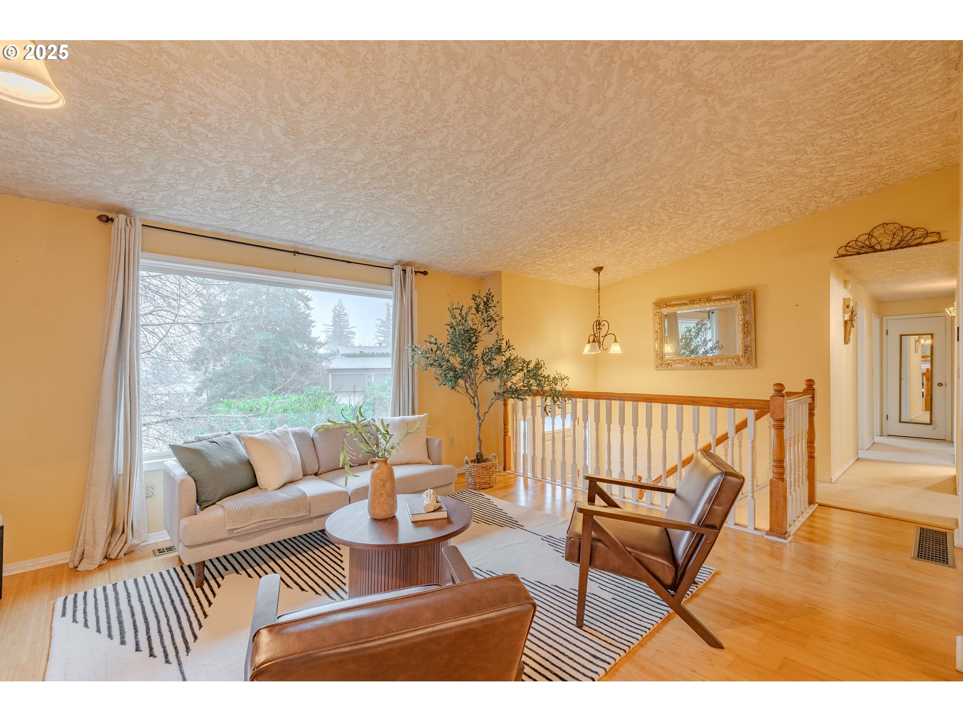 3270 Northwest Ivy Lane Camas, WA 98607 - Photo 5 of 26 a living room with furniture and a floor to ceiling window