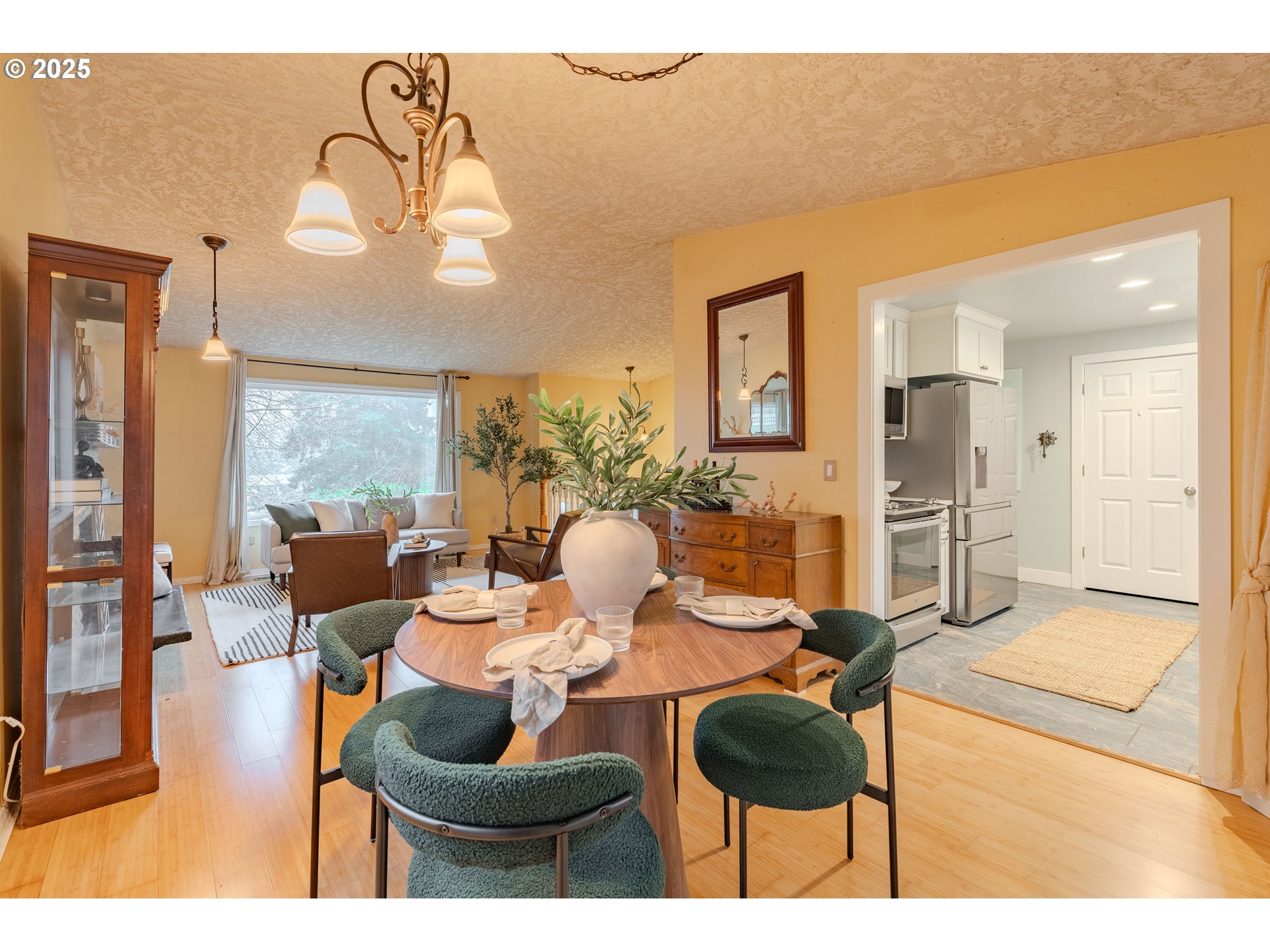 3270 Northwest Ivy Lane Camas, WA 98607 - Photo 8 of 26 a living room with furniture and a chandelier