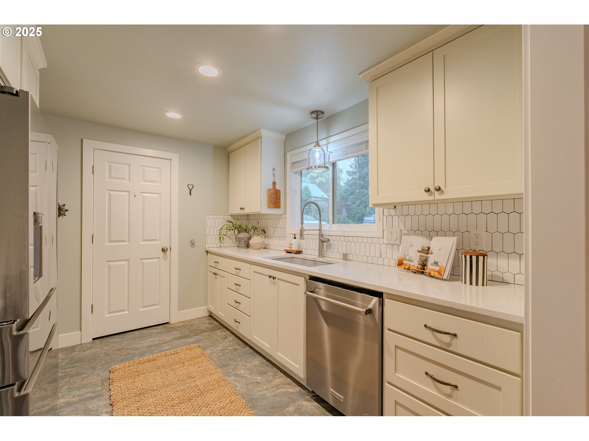 3270 Northwest Ivy Lane Camas, WA 98607 - Photo 9 of 26 a kitchen with a sink and cabinets