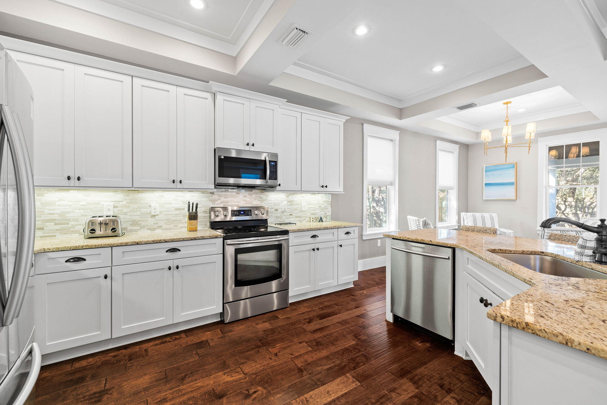 131 Clareon Drive Inlet Beach, FL 32461 - Photo 13 of 62 a kitchen with granite countertop white cabinets sink and stainless steel appliances
