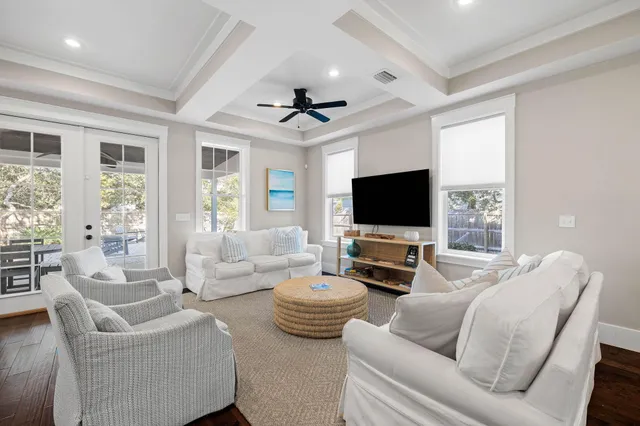 a bedroom with furniture and a large window