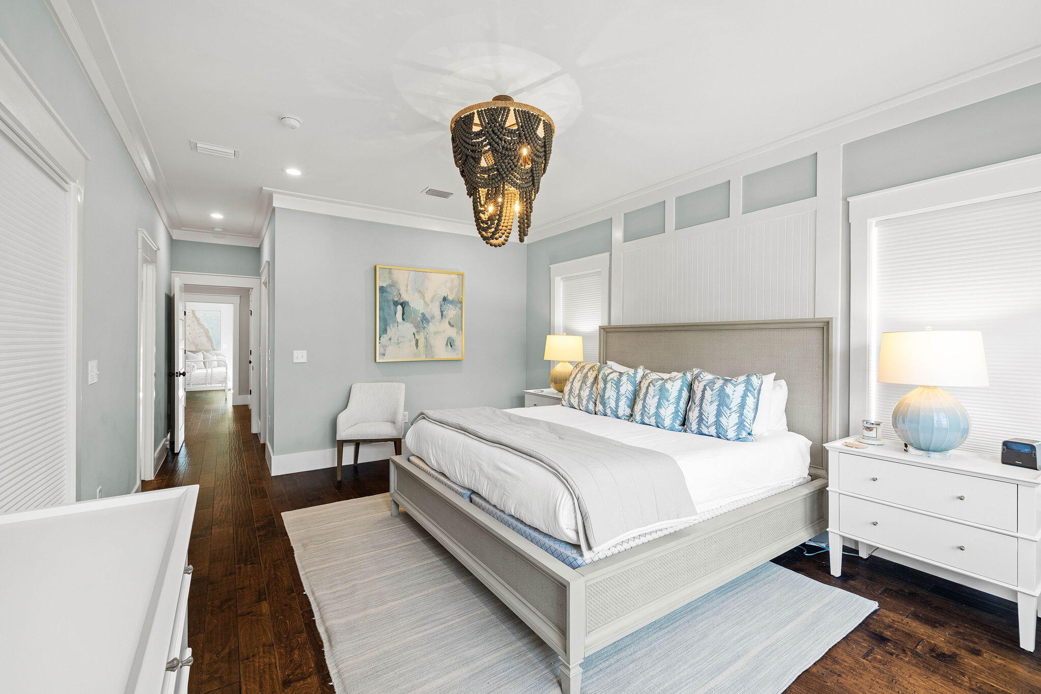 131 Clareon Drive Inlet Beach, FL 32461 - Photo 27 of 62 a bedroom with a large bed and a chandelier